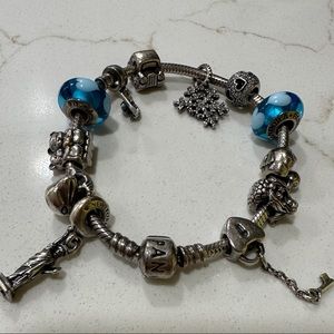 Woman’s Pandora bracelet with charms